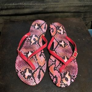 Red snake print flip flops